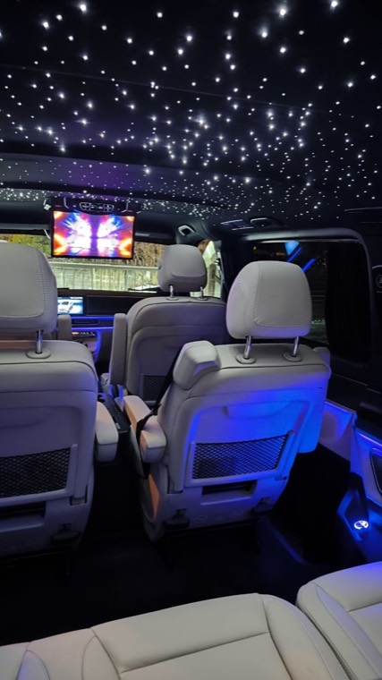 Mercedes V-Class interior with a starry-sky ceiling and ambient lighting, ready for a bachelor party