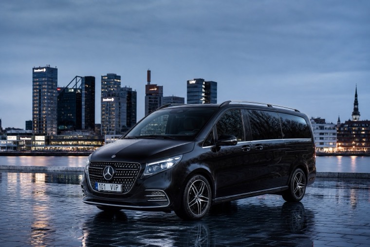 Mercedes V-Class at blue hour in front of a modern city skyline